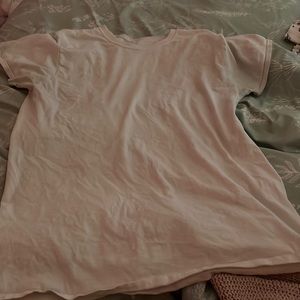 Plain white tee. 100% cotton and very comfortable!